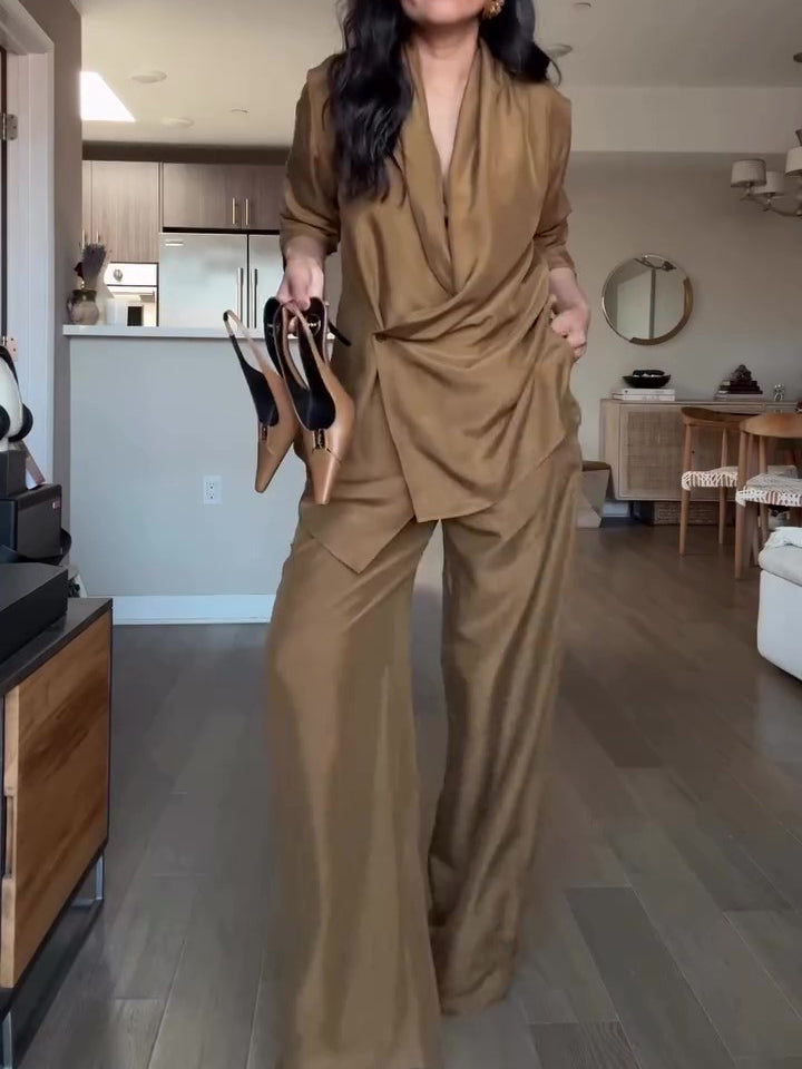 Elegant tan wrap-style satin blouse and wide-leg pants set, perfect for a sophisticated formal look.