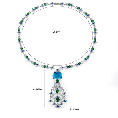 Elegant long crystal and ruby-toned statement necklace worn by a woman in a white dress, ideal for formal luxury fashion and evening events in the UAE.