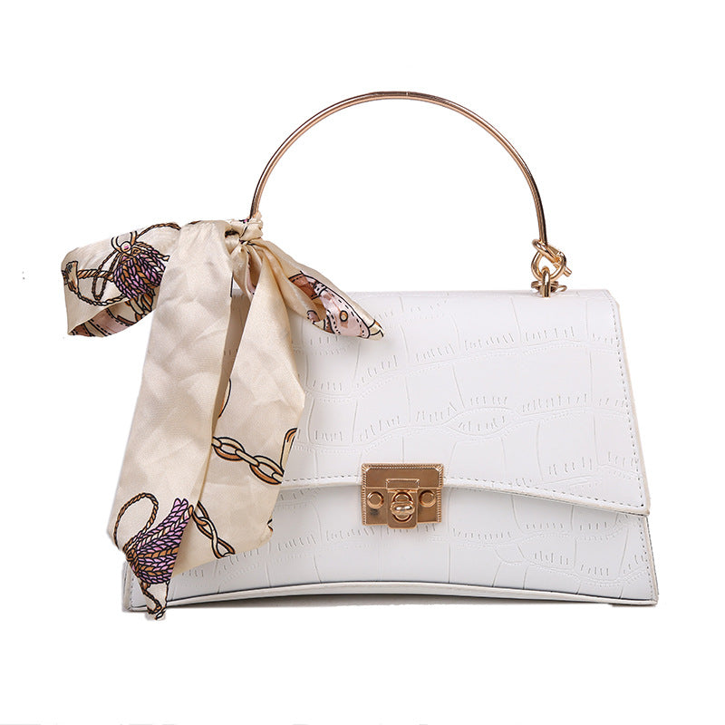 Stylish black textured crossbody handbag with decorative silk scarf accessory, perfect for modern daily and fashion-forward looks in the UAE.