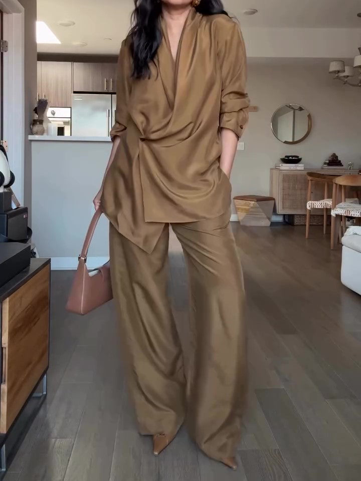 Elegant tan wrap-style satin blouse and wide-leg pants set, perfect for a sophisticated formal look.