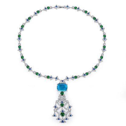 Elegant long crystal and ruby-toned statement necklace worn by a woman in a white dress, ideal for formal luxury fashion and evening events in the UAE.