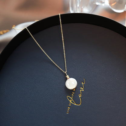 Close-up of an elegant gold floral-shaped geometric necklace with sparkling crystals, displayed on a dark surface for a luxury fashion look.