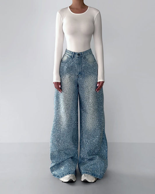 these Irregular Rhinestone Jeans offer a bold and glamorous look. Perfectly crafted for trendy outings in the UAE, this sparkling denim adds an instant statement to your wardrobe. Shop this exclusive style at FASHIONARIE CLUB.