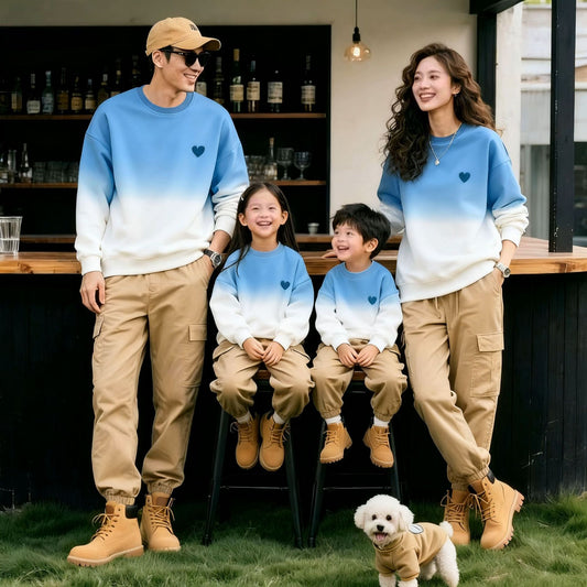 Stylish matching blue and white ombre family co-ord sweatshirt set with khaki cargo pants for parents and kids, perfect for fall and winter fashion in the UAE.