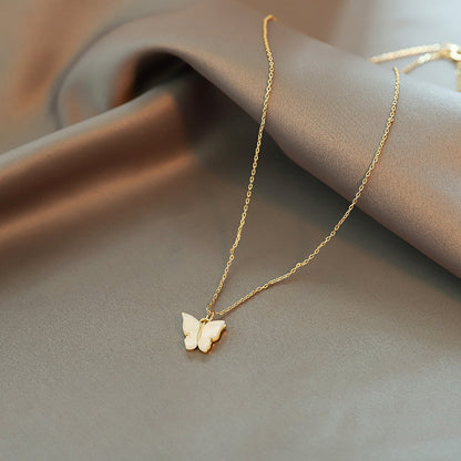 Close-up of an elegant gold floral-shaped geometric necklace with sparkling crystals, displayed on a dark surface for a luxury fashion look.