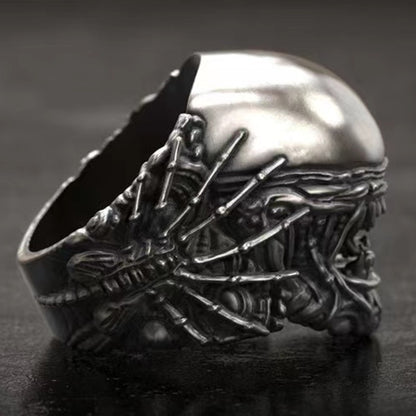 Close-up view of a unique, exaggerated retro skull and alien design statement ring, perfect for gothic or punk fashion accessories in the UAE