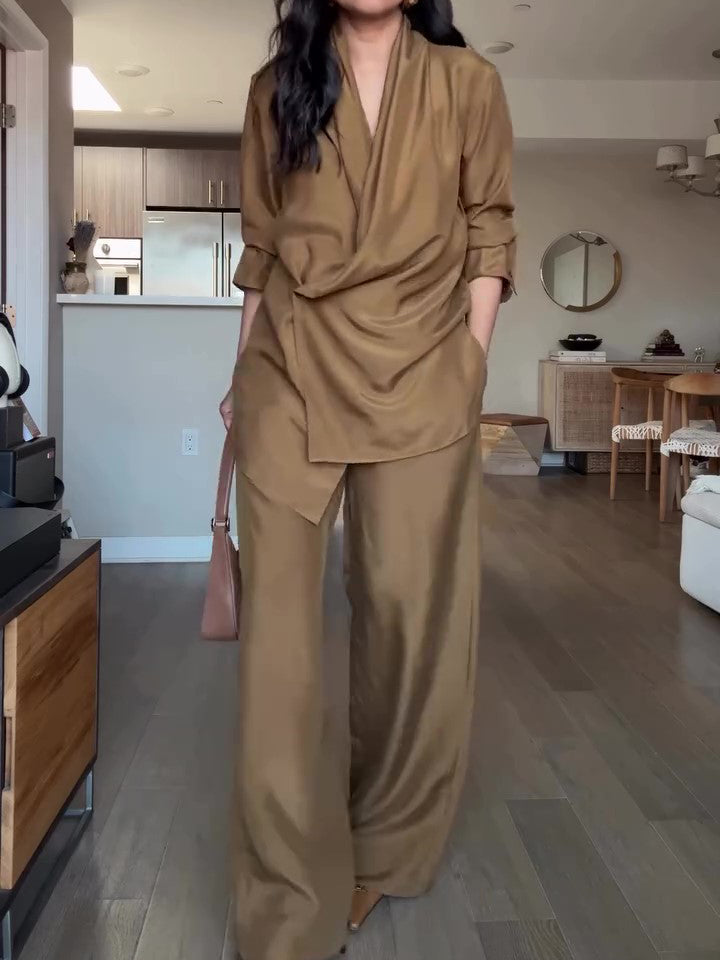 Elegant tan wrap-style satin blouse and wide-leg pants set, perfect for a sophisticated formal look.